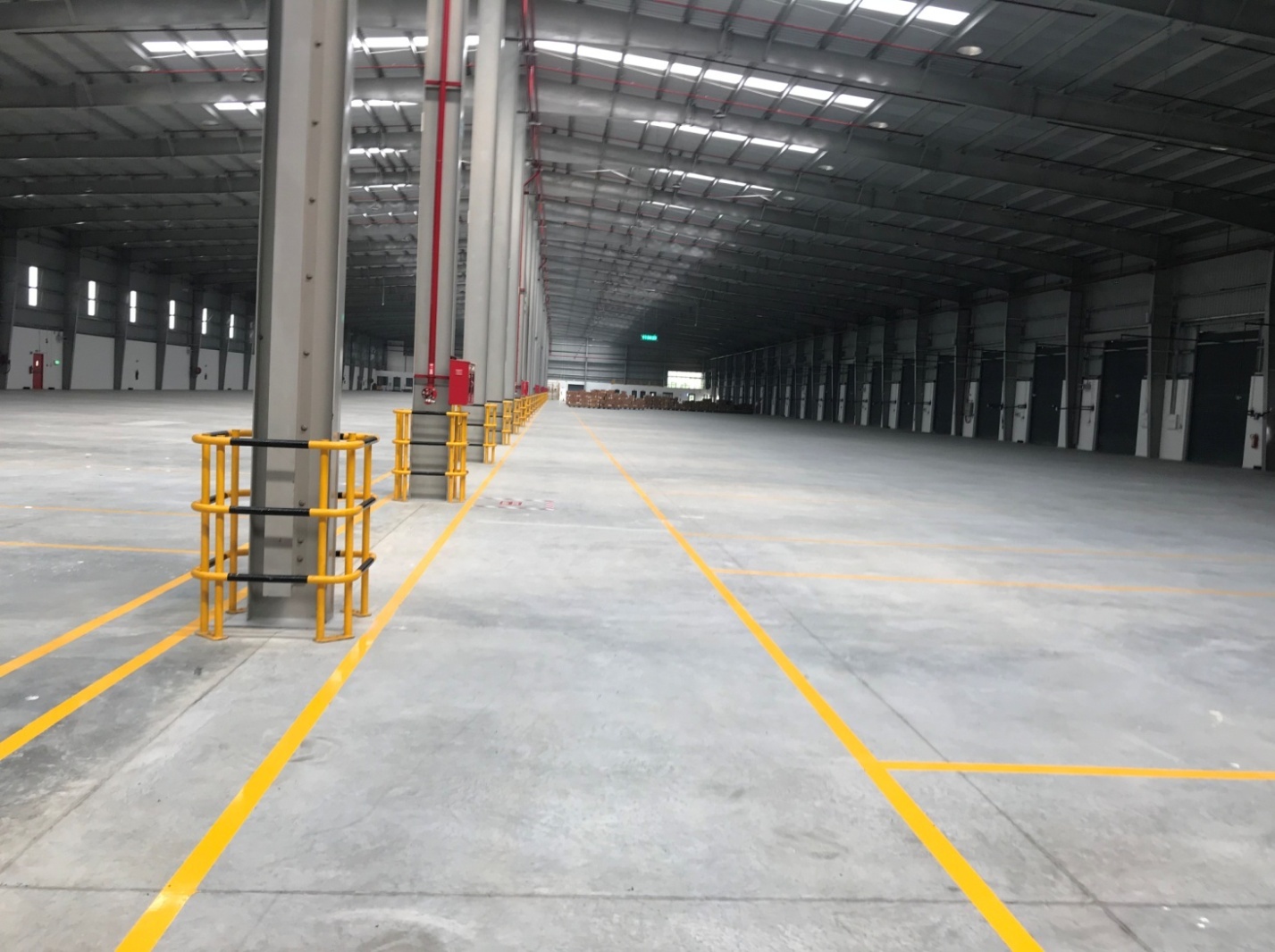 Large warehouse interior with yellow floor markings